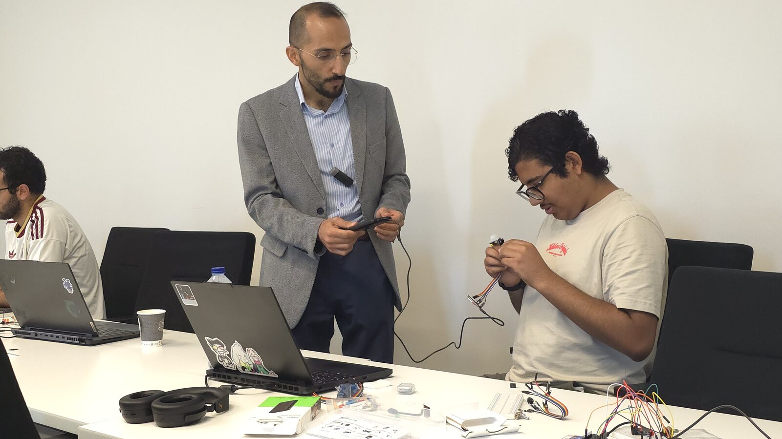 Demonstrating sensor wiring with a student